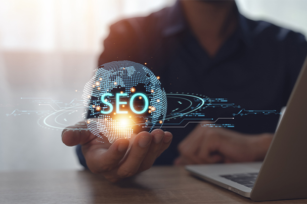 A Hand Holding A Glowing Digital Globe With The Word Seo Centered On It A Hand Holding A Glowing Digital Globe With The Word Seo Centered On It