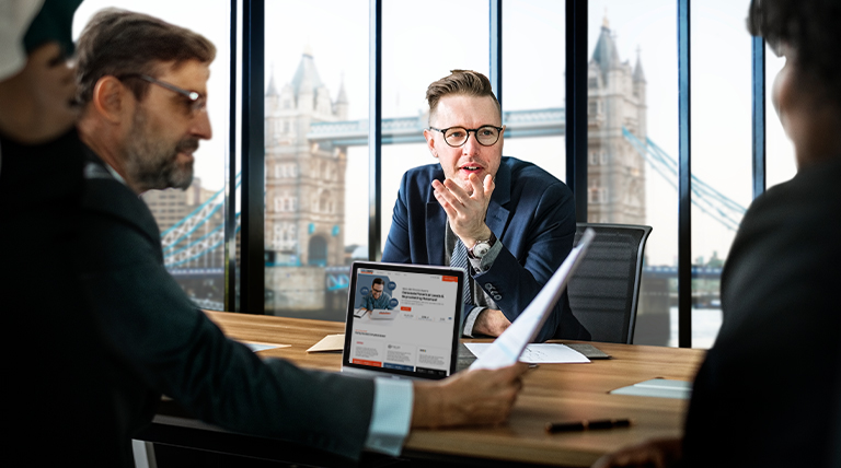 Business Meeting Discussion With London Bridge View In Background